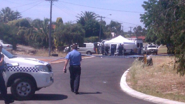 Police cars and tape blocked the road today with crime scene investigators working through the night.