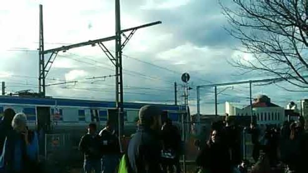 Passengers are forced off a Metro train near Westall station.