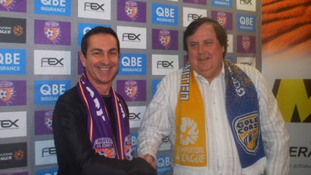 Perth Glory owner Tony Sage and Gold Coast counterpart Clive Palmer strike a cordial pose ahead of their teams' clash on Sunday.
