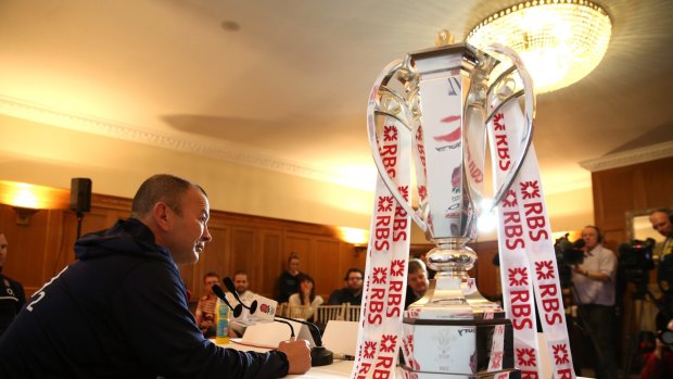Silverware: England coach Eddie Jones alongside the Six Nations trophy.
