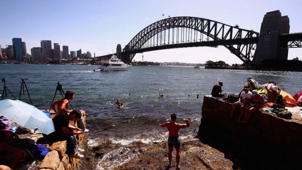 First in best dressed: People take up position in anticipation of New Year's Eve celebrations on Sydney Harbour.
