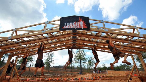Out to dry ... Competitors take on the Tough Mudder's Funky Monkey obstacle.
