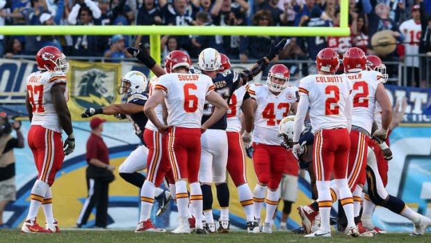 Ryan Succop of the Kansas City Chiefs (centre)  reacts after missing a 41 yard field goal attempt with four seconds left in regulation time.