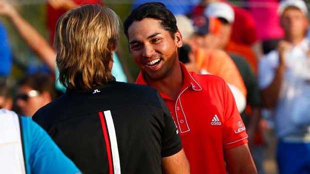 Frenchman Victor Dubuisson (left) congratulates Jason Day after the Australian prevailed in a thrilling final of the WGC Match Play Championship.