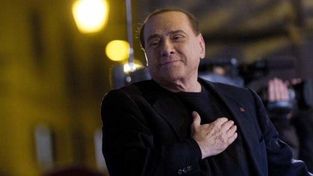 Expelled from parliament ... Silvio Berlusconi listens to the hymn of his party Forza Italia at the end of a rally in Rome before the Senate vote.