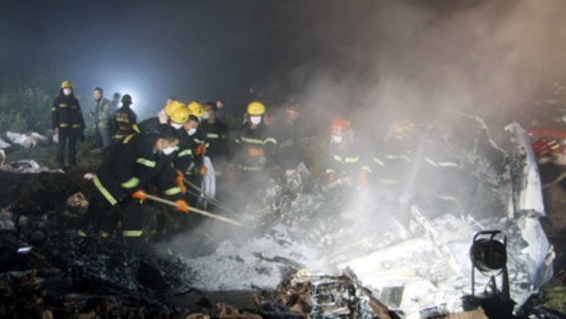 Rescuers work at the site of a reported plane crash at an airport in northeast China's Heilongjiang province.