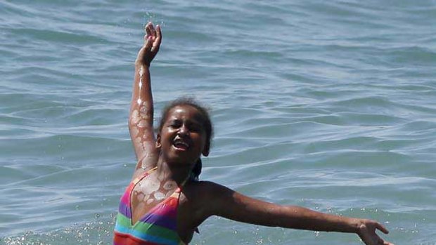 Sasha, daughter of U.S. first lady Michelle Obama, bathes in the Mediterranean Sea in Estepona during their vacation in southern Spain. <i>Picture: Reuters/Jon Nazca</i>