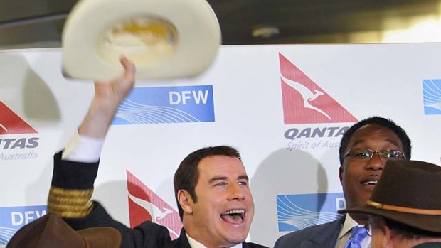 Got chills ... 'Aussie' John Travolta was on hand to welcome the first passengers to fly the Sydney-Dallas route.