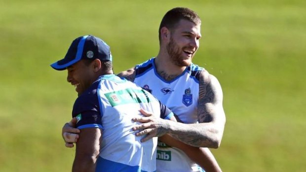 Centres of attention: Josh Dugan (right) bonds with Michael Jennings at Blues training.