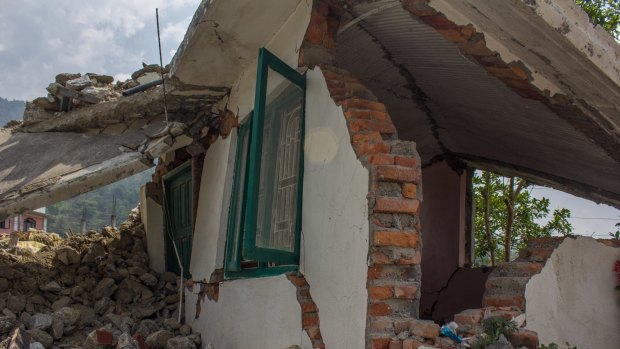 The Giri family was at a wedding when their home fell to pieces in the earthquake, crushing their two cows.