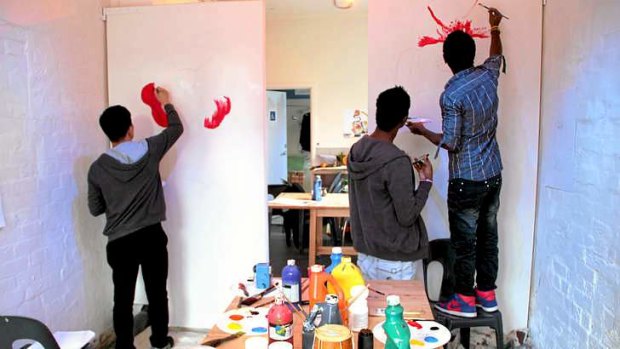 Asylum seekers take part in a painting workshop with Jesuit Social Services.