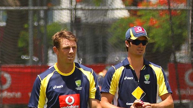James Pattinson and Ben Cutting await their turns to bowl in the nets.