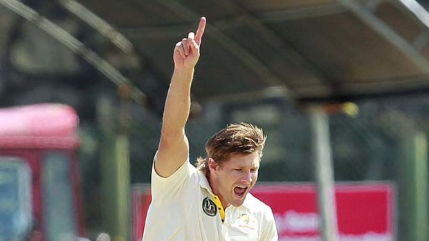 Shane Watson celebrates after taking the wicket of Sri Lanka's Angelo Mathews on the fourth day of the first Test.