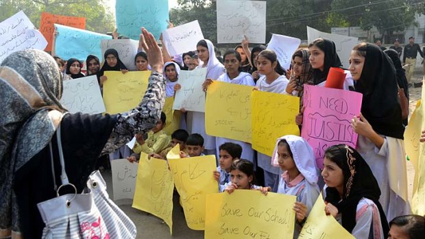 Raised voices ... Asim Farooqi's Pakistani students protest against blasphemy charges.