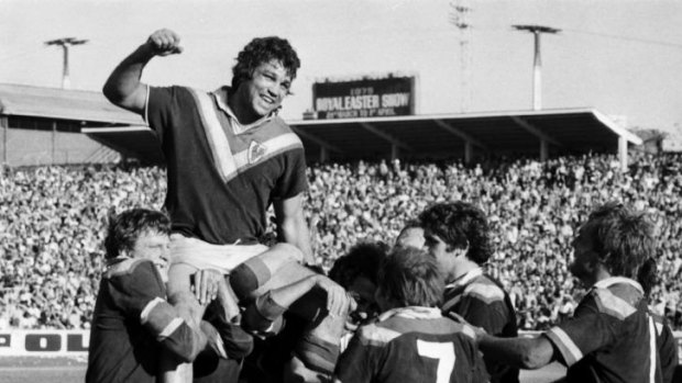 Legend: Arthur Beetson leads the Roosters to the 1974 premiership.