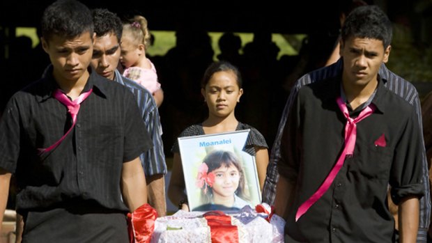 Local clan and community members attended the funeral of nine-year-old tsunami victim Moanalei Sarah Long, one of many burials in Western Samoa on Friday.