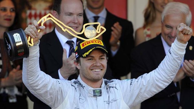 Like father like son: Mercedes' Nico Rosberg claims victory in front of dignitaries in Monaco.