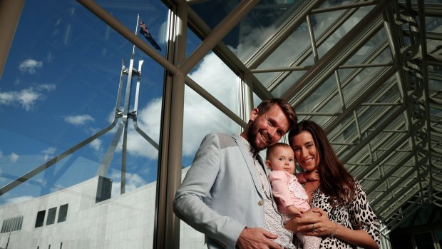 Jonathan McElwee and Bethan McElwee with their one-year-old daughter Aviana, who visited Parliament House in Canberra for a Spinal Muscular Atrophy Australia event on August 16, 2017.