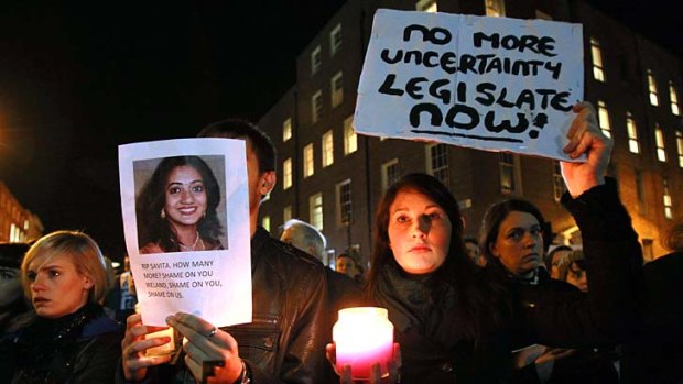 Candlelight vigil ... demonstrators gather outside the Irish parliament following the death of Savita Halappanavar, who had been refused an abortion.
