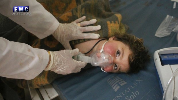 A Syrian doctor treats a child following the chemical attack in Khan Sheikhoun, Syria.