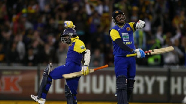 Angelo Mathews (left) and Muttiah Muralitharan celebrate Sri Lanka's amazing comeback victory over Australia at the MCG.