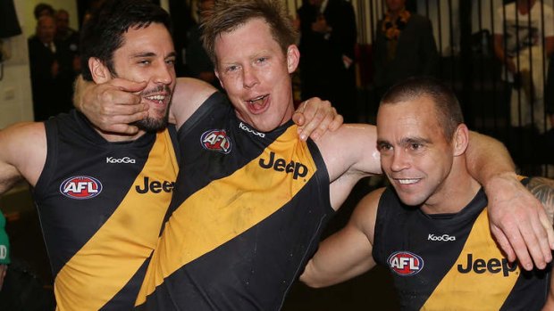 Troy Chaplin, left, celebrates  a win with Jack Riewoldt and Jake King.