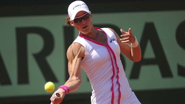 Samantha Stosur hits a return to Britain's Elena Baltacha during her first round match at the French Open yesterday.