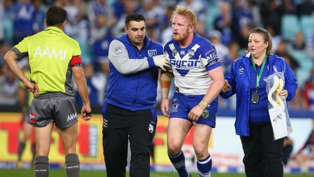 Wobbly boots: James Graham leaves the field after a heavy knock against the Sydney Roosters at ANZ Stadium on May 15.