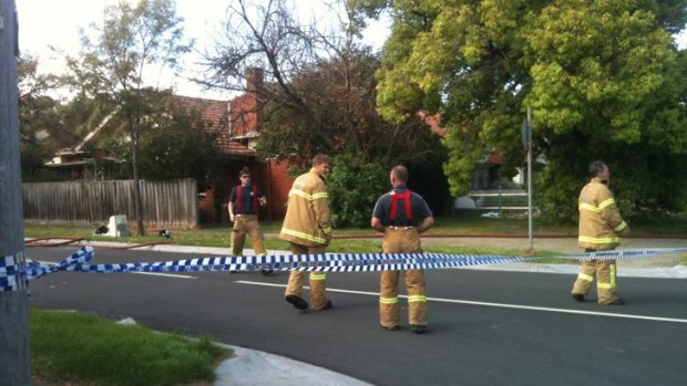 The scene at Kew, where emergency services personnel are investigating the cause of a house fire that this morning claimed a woman's life.