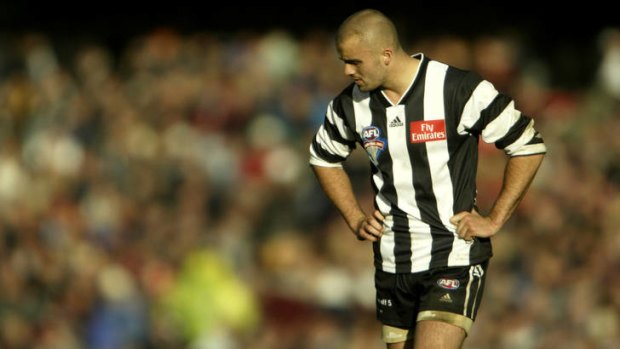 Low point: A dejected Rhyce Shaw after Collingwood lost the grand final  in 2003.