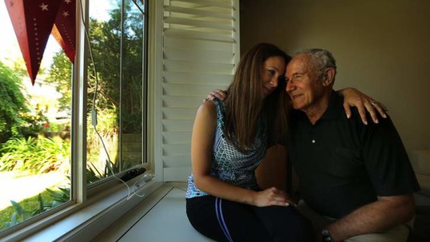 Cuts to the workers compensation scheme will leave Adrian, 73, pictured with his daughter Diana Siddall, with little money for his hearing aid and cochlear implant.