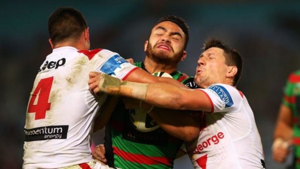 Heavy traffic: Dylan Walker of the Rabbitohs is stopped in his tracks.
