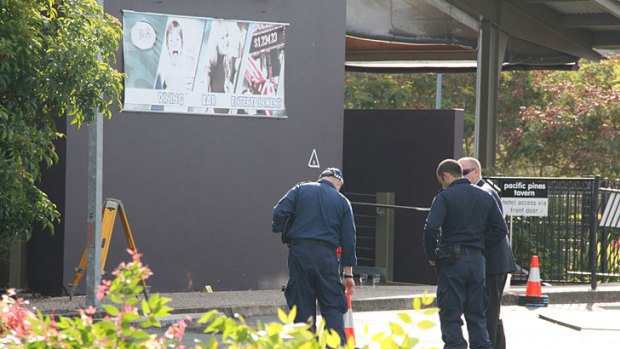 Police continue investigations at the Pacific Pines Tavern, where Senior Constable Damian Leeding was shot on Sunday night.