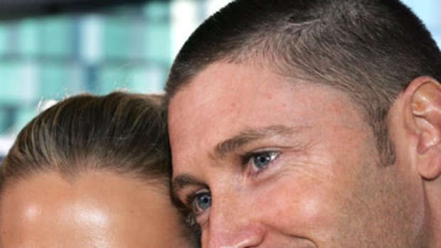 Heading home ... Michael Clarke with Lara Bingle.