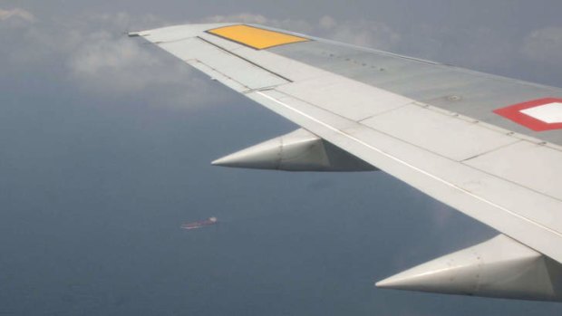 This handout photograph released by the Indonesian Air Force on March 12, 2014 shows the view from an Indonesian Air Force military surveillance aircraft on March 11 over the Malacca Strait, a passageway between Indonesia and Malaysia, searching for the missing Malaysia Airlines flight MH370.