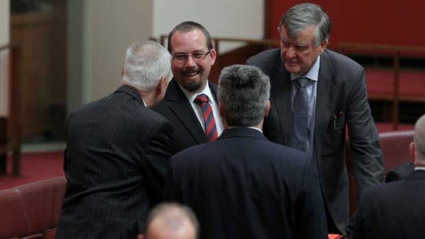 Welcome: Senator Ricky Muir congratulated by fellow Senators after being sworn-in.