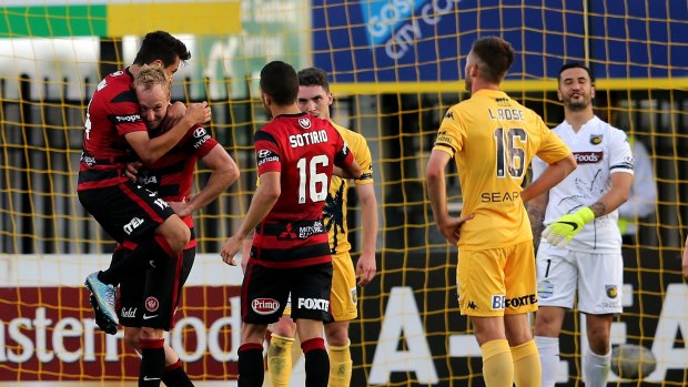 Western Sydney Wanderers celebrate after a goal by Mitch Nichols against Central Coast Mariners.