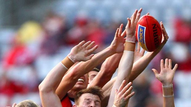 Under pressure: St Kilda's Brendon Goddard takes a leap of faith against the Swans at ANZ Stadium.