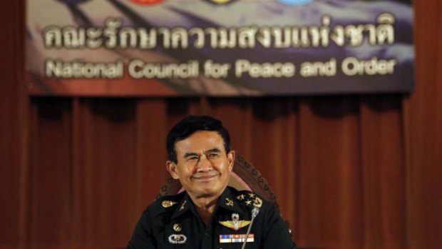 Deputy chief of Thailand's junta General Paiboon Koomchaya, announces the interim constitution.