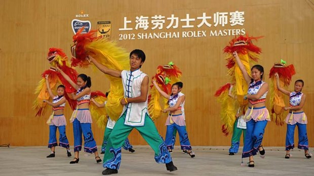 Dancers get ready for a performance at the Shanghai Masters tournament yesterday.