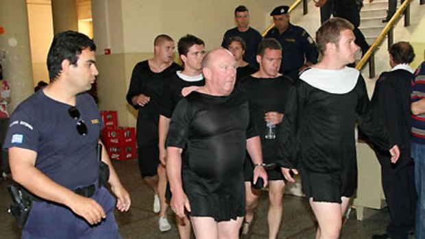 The British tourists appear in the Heraklion courtroom, Crete, still dressed as nuns.