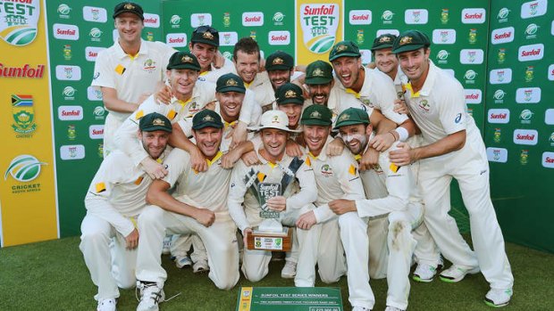 On the up: Australia celebrates their series victory over South Africa in Cape Town.