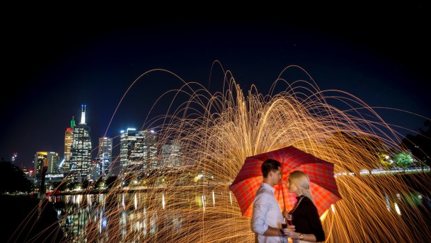 A set up photo of a young couple, Giacomo Bell and Ellen Weigall, at the Yarra for a New Year's Eve story.