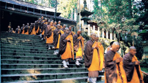 Wise steps ... a procession of Shingon Buddhist monks leaves Torodo temple in Koyasan.