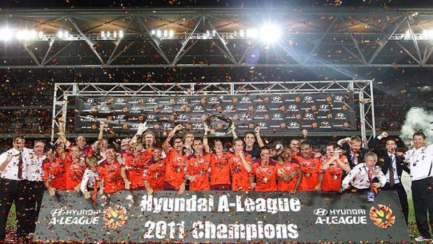 The Roar celebrate victory during the A-League grand final.