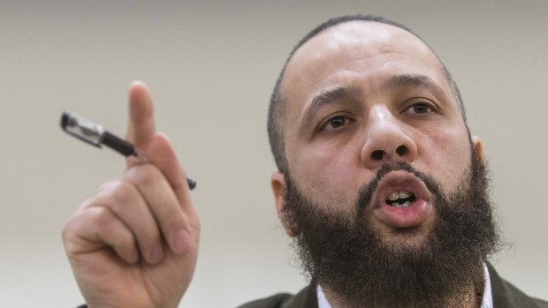 Muslim teacher Adil Charkaoui speaks to reporters during a press conference at the Centre St-Pierre in Montreal, Quebec. Charkaoui has denied he had radicalised Canadian teens believed to have headed to Syria to fight with IS.