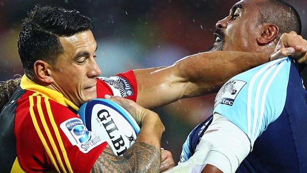 Sonny Bill Williams of the Chiefs fends off Jerome Kaino.