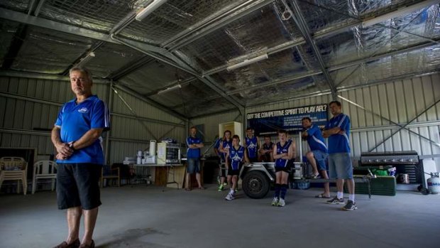 Chairman of the Gungahlin Jets Football Club Joe Cortese with the half built shed after federal government withdrew its funding support to build it.