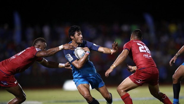 APIA, SAMOA - JUNE 02: Melani Nanai of the Blues is tackled during the round 15 Super Rugby match between the Blues and the Reds at Apia Park National Stadium on June 2, 2017 in Apia, Samoa. (Photo by Phil Walter/Getty Images)