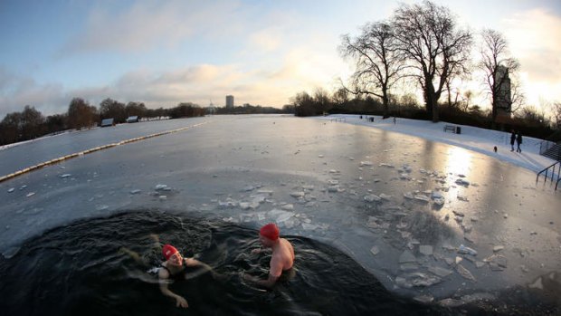 Icy dip ... swimmers brave the Serpentine lake in London's Hyde Park.